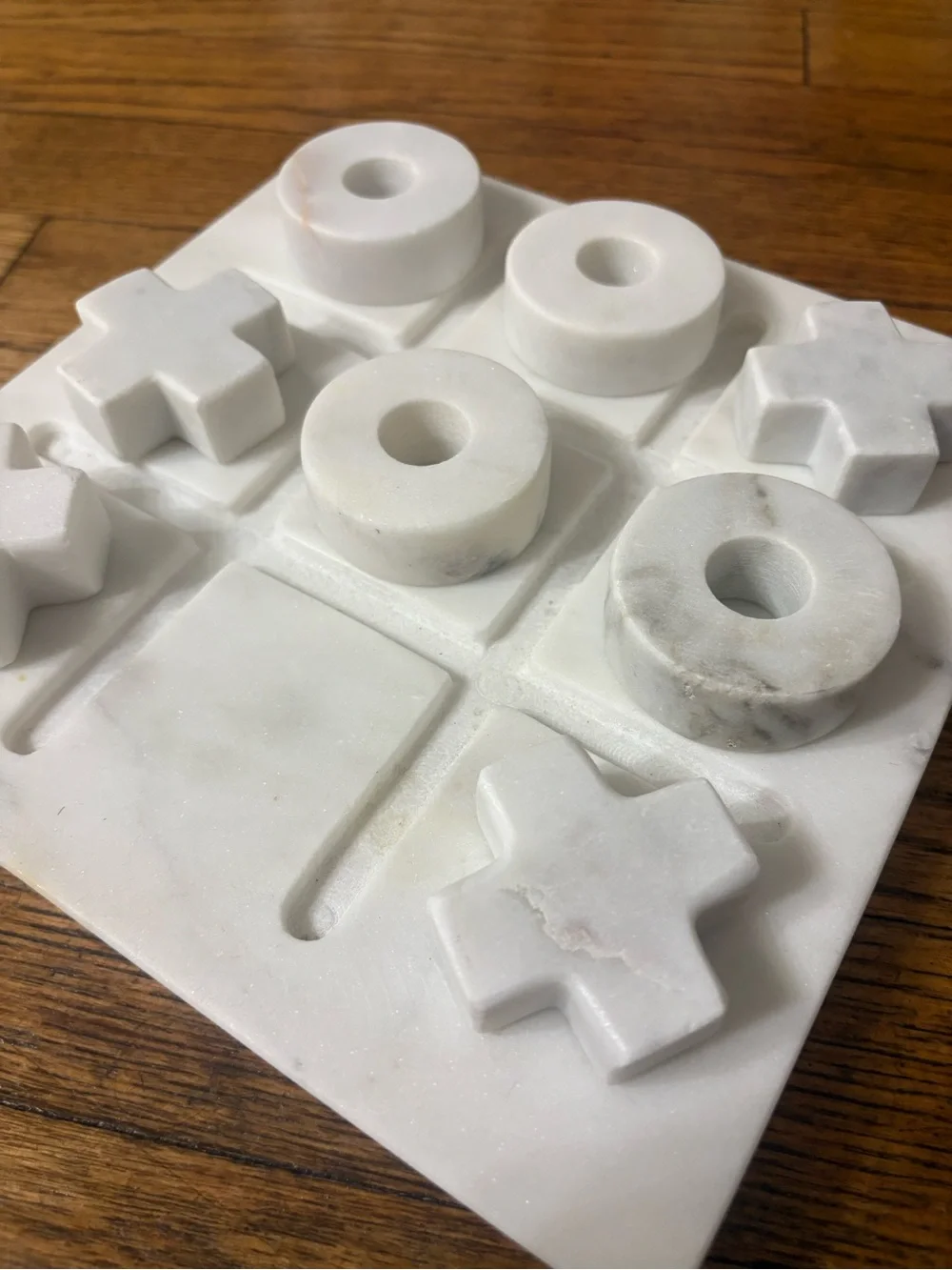 Crate&Barrel White Marble Tic Tac Toe Set with Carved X and O Pieces